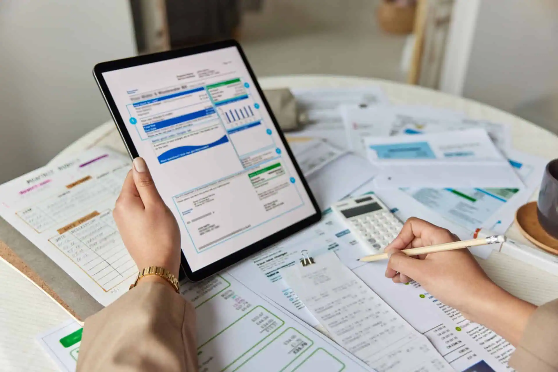 bookkeeper going through receipts and financial paperwork