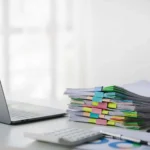 Tranmere Bookkeeping - Making Tax Digital - financial records neatly stacked and sorted on a desk