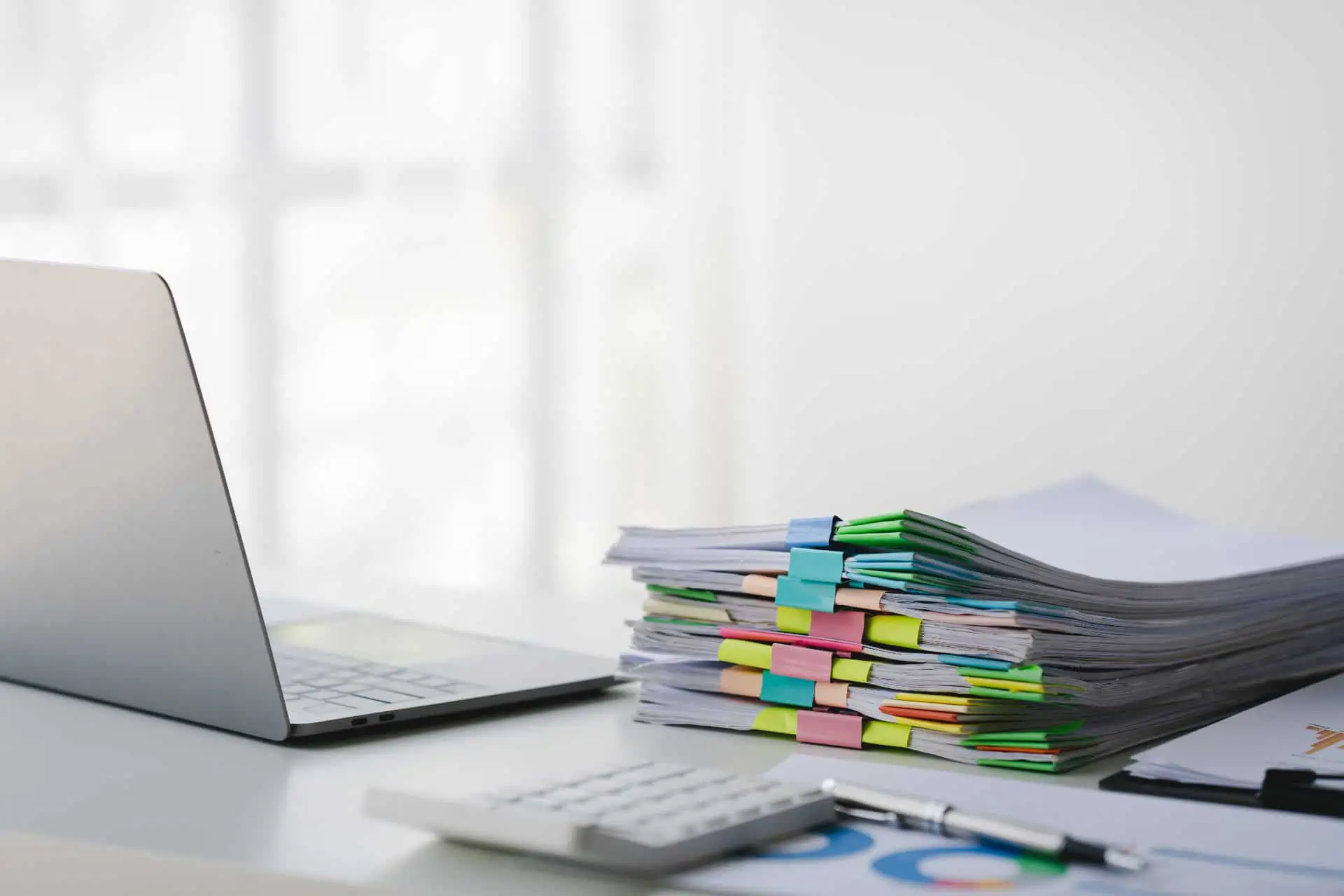 Tranmere Bookkeeping - Making Tax Digital - financial records neatly stacked and sorted on a desk